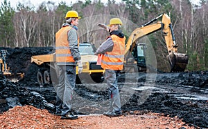 Two quarry workers discussing what to do next