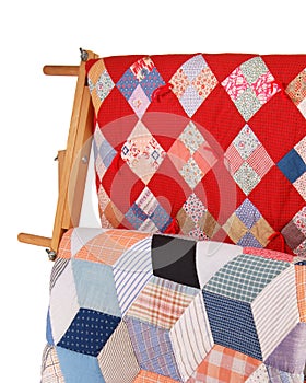 Two Quilts On A Wood Rack