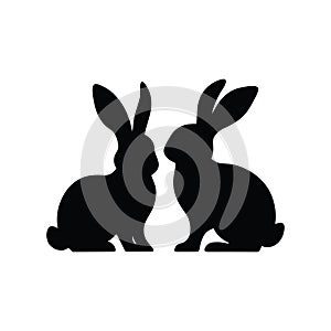 Two Rabbit Silhouettes Facing Each Other on White Background