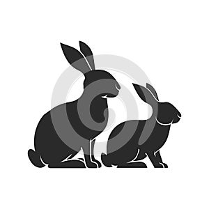Two Rabbit Silhouettes Sitting Isolated on White Background