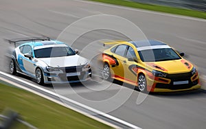 Two race cars racing at high speed