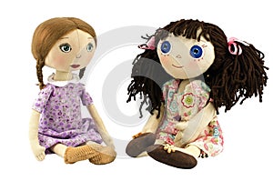 Two rag doll girls with blond and brow hairs