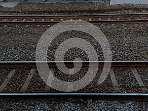 Two railroads on pebbles surface at train station