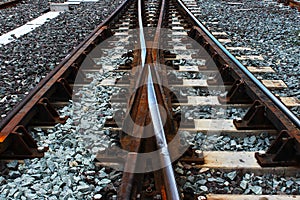 Two railway tracks converge into one track