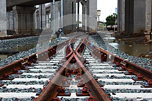 Two railway tracks converge into one track photo