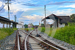 Two railway tracks merge together