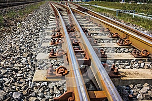 Two railway tracks merge together