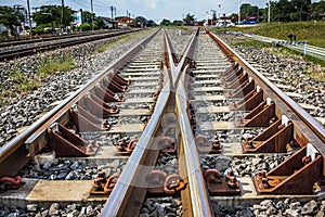 Two railway tracks merge together