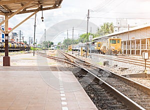 Two railway tracks merge together to station platform