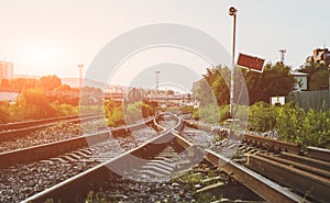 Two railways tracks merge close up.Vintage tone