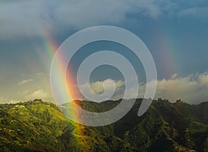 Two rainbows in a beuatiful mountain. photo