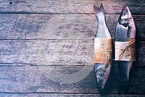 Two raw bass fish