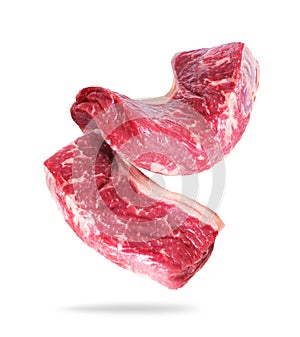 Two raw beef steaks close-up isolated on a white background