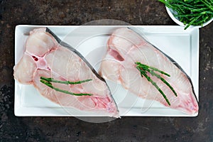 Two raw halibut steaks