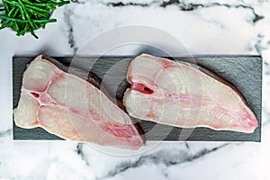 Two raw halibut steaks