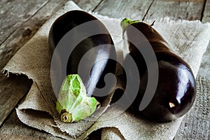 Two raw organic eggplant on sackcloth