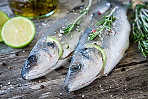 Two raw seabass with lime and rosemary