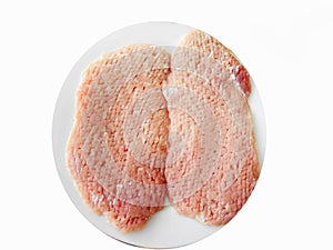 Two raw tenderized Pork Schnitzel