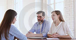 Two recruiters hr managers interviewing handshaking young female job candidate