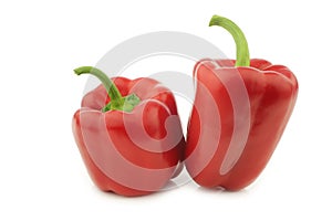 Two red bell peppers `capsicum`