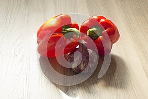 Two red bell peppers and garlic