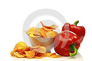 Two red bell peppers and paprika chips