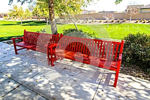 Two Red Benches At Public Park