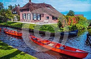 Two red boat in the Giethoorn canal