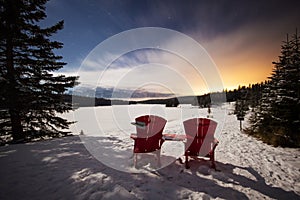 Two red chairs in mountains view a view to frozen lake under amazing night sky with stars, moving clouds and last sun beams, Two j