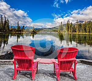 Two red chaise lounges