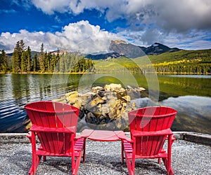 Two red chaise lounges for the tourists