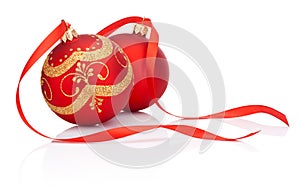 Two Red christmas decoration balls with ribbon bow isolated