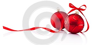 Two red Christmas decoration baubles with ribbon bow isolated on