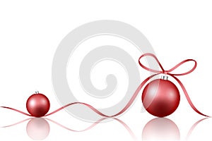 Two red Christmas decoration baubles with ribbon bow isolated on white background