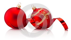 Two red Christmas decoration baubles and shiny curling ribbon Isolated on white background