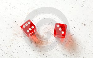 Two red craps dices showing Centerfield Nine Nina number 6 and 3 overhead shot on white board photo