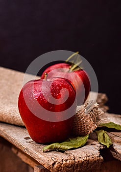 Two red delicious apple dark photo rustic eyedrops light color fresh