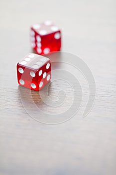 Two Red Dices Isolated on Desktop