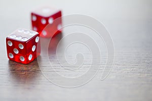 Two Red Dices Isolated on Desktop