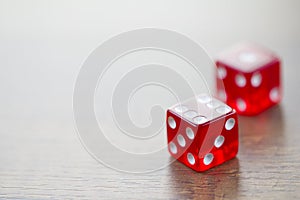 Two Red Dices Isolated on Desktop