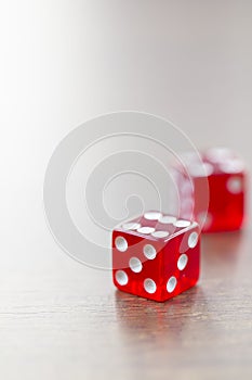 Two Red Dices Isolated on Desktop