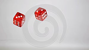 Two red dices in super slow motion rebounding