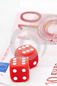 Two red dices on ten euro bill