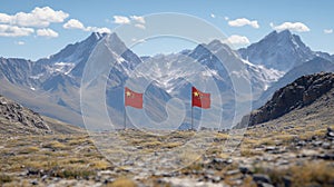 Two Red Flags on a Mountain Landscape