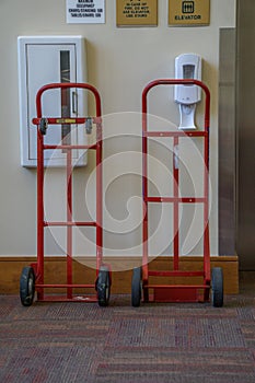 Two Red Hand Trucks Waiting to be of Service