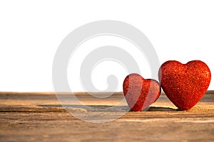 Two red heart decorated on wooden background. Concept Valentine