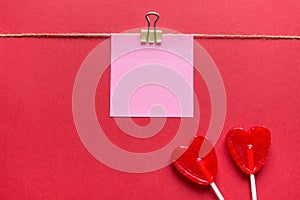 Two Red Heart Shape Candy Lollipops on Sticks Post It Sticky Paper Clipped on Twine. Valentine Romantic Love Greeting Card