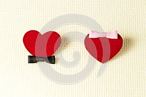 Two red hearts as symbols heterosexual couple in love