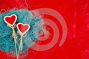 Two red hearts on a red background, bright background