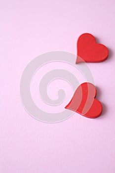 Two red hearts. Pink background. Valentines day. Wedding invitation design